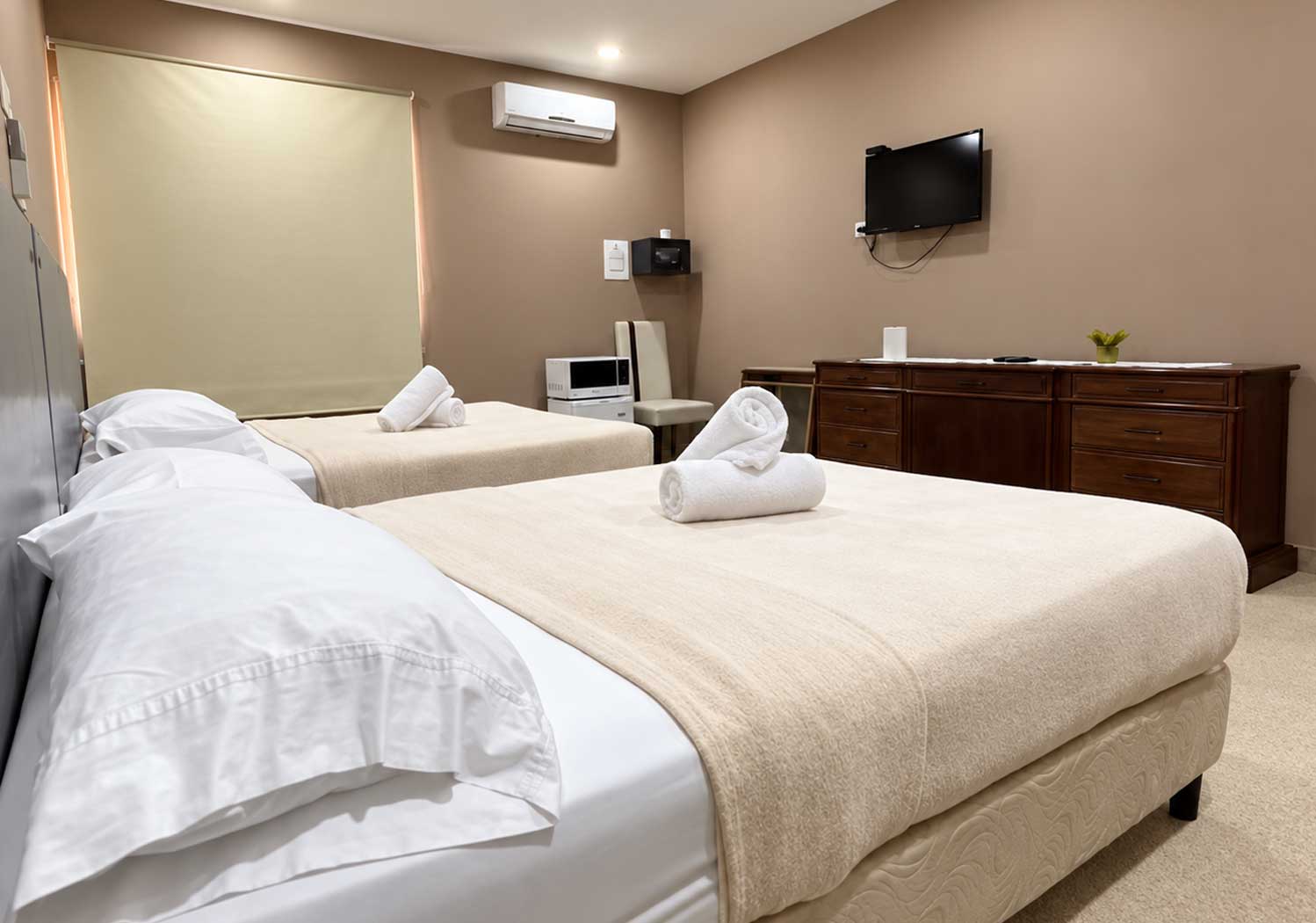 Spacious room with two beds and a TV Spacious Room With Two Beds And A TV, Spanish Classes In Panama | Learn Spanish Abroad | Spanish Language Immersion Programs